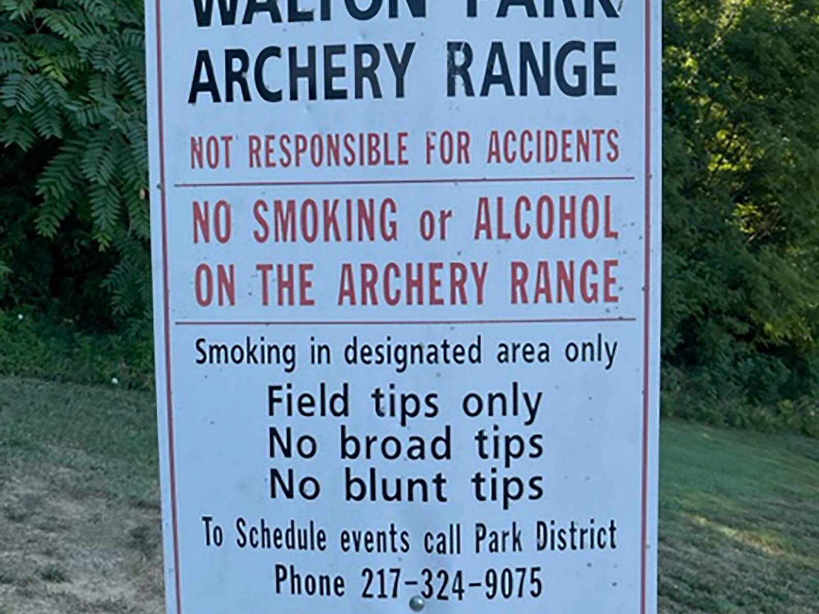 sign explaining rules at the archery range