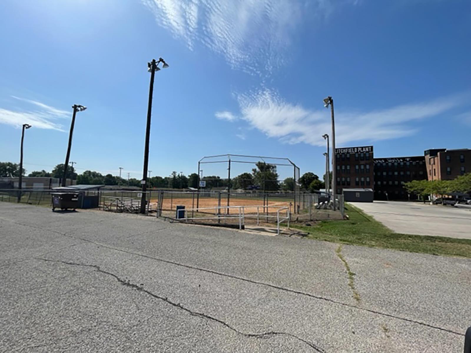 parking lot and back stop at Schalk Field