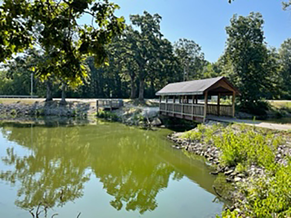 covered walkway bridge and trail near the lake at Walton Park