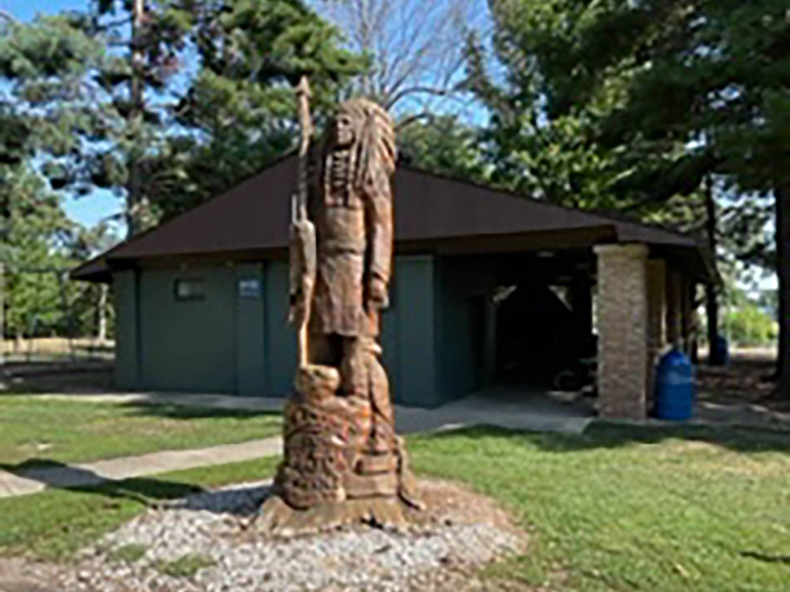 wood statue outside of a pavilion at Walton Park